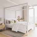 white wooden four poster bed