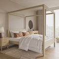 Wooden oak four poster bed in a modern bedroom with light decor